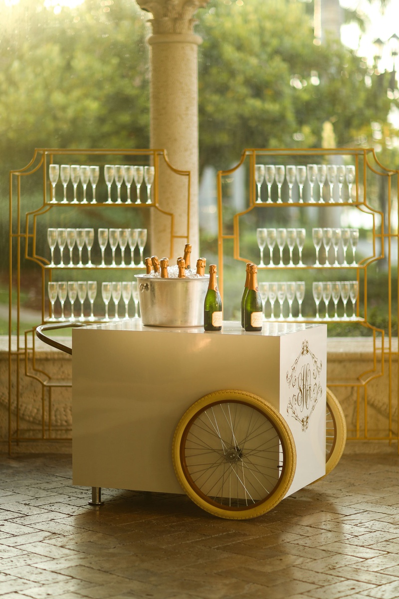 Monogrammed Champagne Cart
Photography: Alain Martinez Photography
Read More:
http://www.insideweddings.com/weddings/opulent-luxury-wedding-with-white-gold-color-scheme-in-palm-beach/1375/ wedding reception cocktail hour vintage style champagne bar cart with couple monogram ice bucket