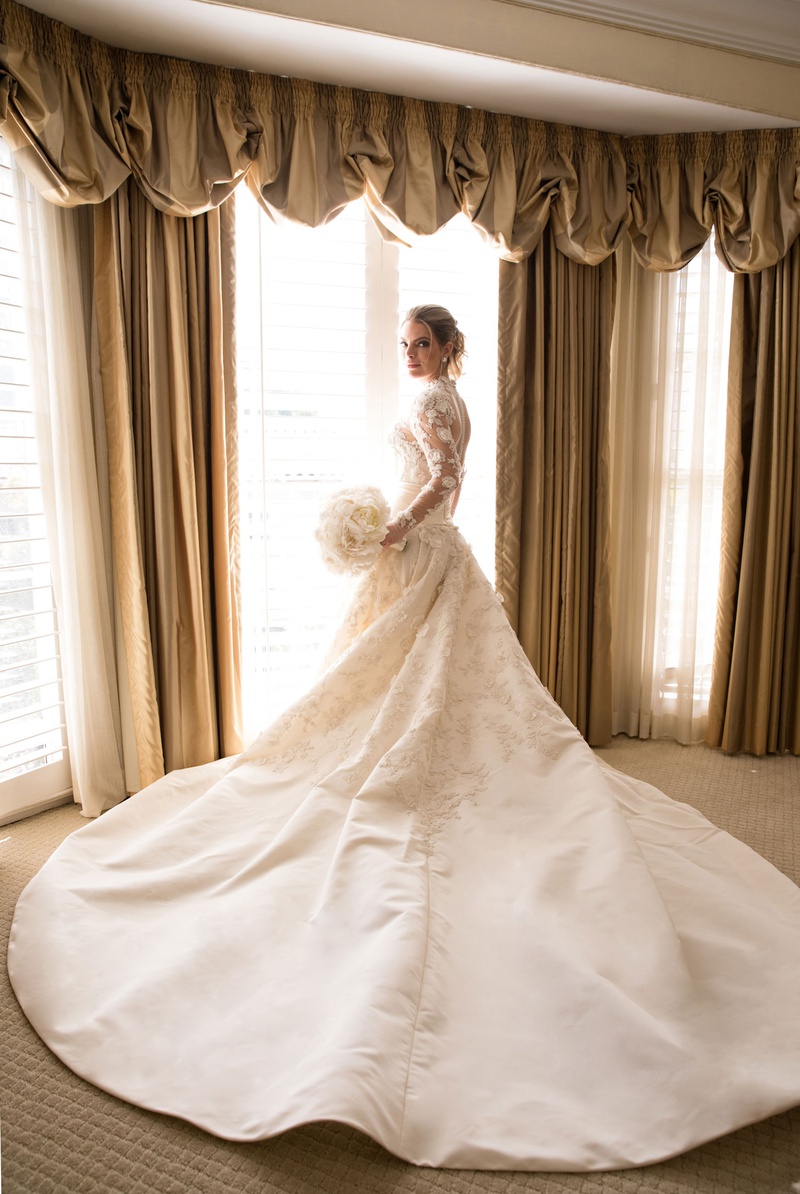 Bride in Couture Gown with Ivory Bouquet
Photography: Duke Photography
Read More:
http://www.insideweddings.com/weddings/luxurious-alfresco-ceremony-ballroom-reception-in-beverly-hills/1161/ Bride in marchesa couture wedding dress high neck illusion long sleeves long train white bouquet