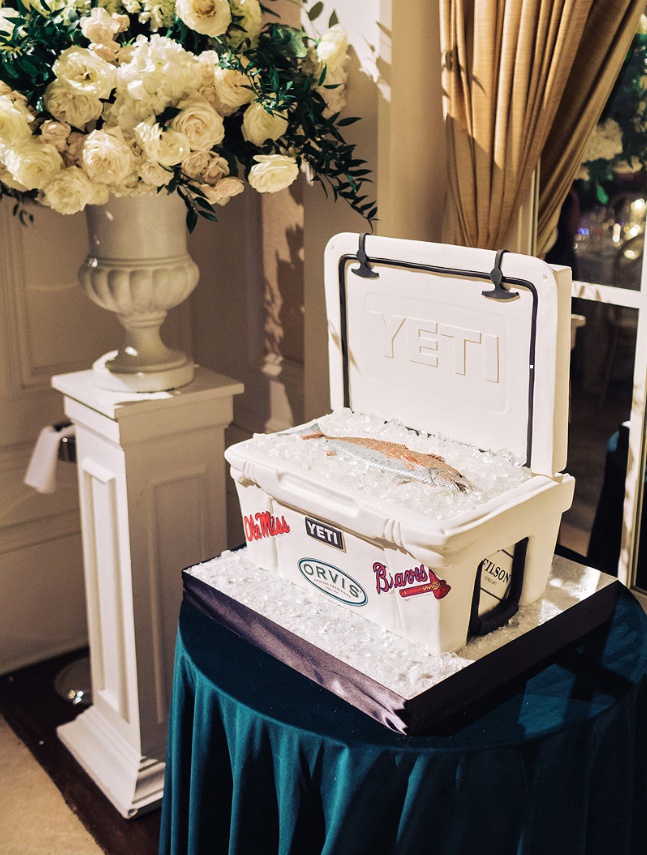 Yeti Cooler Groom's Cake
Photography: Amy Arrington Photography
Read More:
http://www.insideweddings.com/weddings/hometown-winter-wedding-with-gold-details-modern-decor-in-atlanta/1343/ wedding cake ideas groom cake yeti cooler with fish and ice