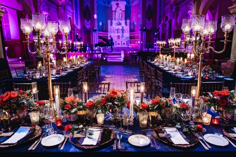 Dramatic Reception in Quebec City
Photography: Joel %26 Justyna
Read More:
http://www.insideweddings.com/weddings/dreamy-winter-destination-wedding-in-an-ice-castle-in-quebec-city/1270/ wedding reception bright purple blue lighting gold candelabra blue linen red flowers candlelight