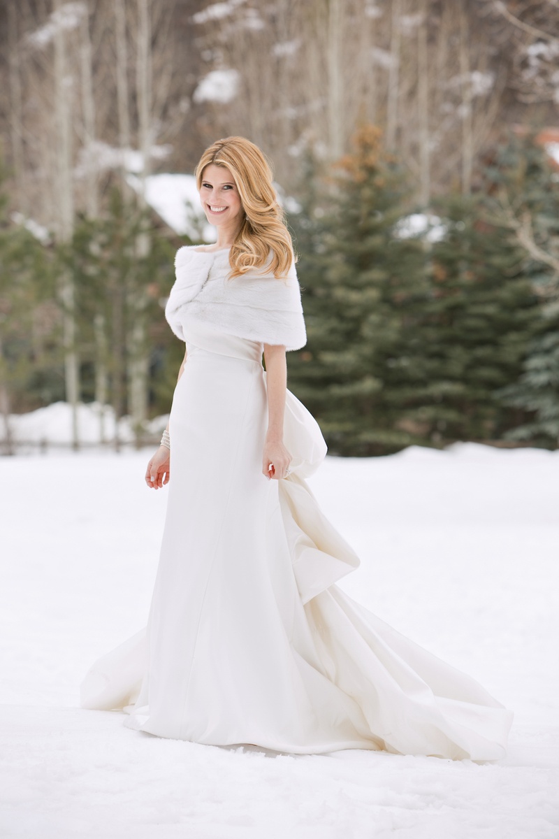 Wintry Bridal Gown
Photography: Aaron Delesie Photographer
Read More:
http://www.insideweddings.com/weddings/snowy-spring-celebration-in-aspen-colorado/596/ Bride wearing ivory wedding dress and fur shawl