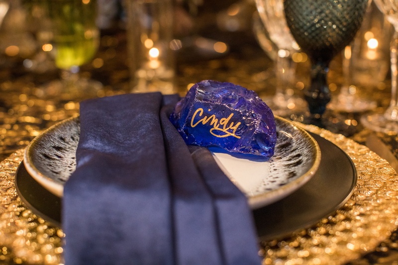 Bright Blue Place "Card"
Photography: Duke Photography
Read More:
http://www.insideweddings.com/weddings/dramatic-tablescape-at-launch-party-for-luxe-linens-newest-line/987/ blue rock place card gold lettering, modern place card
