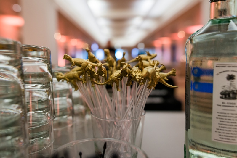 Gold Dinosaur Drink Stirrers
Photography: Kent Drake Photography
Read More:
http://www.insideweddings.com/weddings/an-event-planners-wedding-at-a-museum-by-sue-the-tyrannosaurus-rex/955/ Gold dinosaur t-rex toppers on swizzle sticks drink stirrers at bar The Field Museum