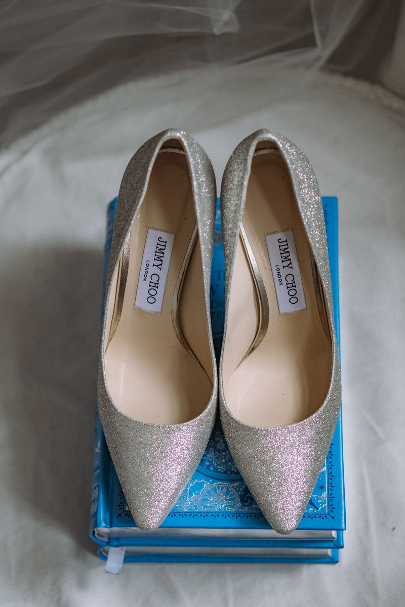 Glittering Sparkle High Heels
Photography: Joel %26 Justyna
Read More:
http://www.insideweddings.com/weddings/dreamy-winter-destination-wedding-in-an-ice-castle-in-quebec-city/1270/ wedding shoes on blue story book ring holder jimmy choo silver glitter heels