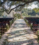 Floral Petal Rustic Wedding Aisle
Photography: Michael Carr Photography
Read More:
http://www.insideweddings.com/weddings/glamorous-outdoor-wedding-with-rustic-rose-gold-details-in-texas/842/ Outdoor wedding ceremony decorations flower petal aisle, flower markers on wood chairs, floral gates