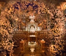 Lush Floral Arches Over Mirror Aisle