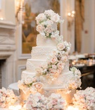 Regal Wedding Cake with Muted Flowers
Photography: Lauren Fair Photography
Read More:
http://www.insideweddings.com/weddings/elegant-wedding-with-muted-regal-decor-at-oheka-castle-in-new-york/1243/ five layer regal wedding cake with fresh flowers cascading down pink and white flower decor