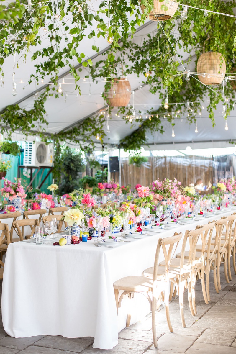 Bistro Lights Over Rehearsal Dinner Space
Photography: Maya Myers Photography
Read More:
http://www.insideweddings.com/weddings/colorful-tented-rehearsal-dinner-with-garden-elements-in-brooklyn/1188/ tented rehearsal dinner with bistro lights above the tables