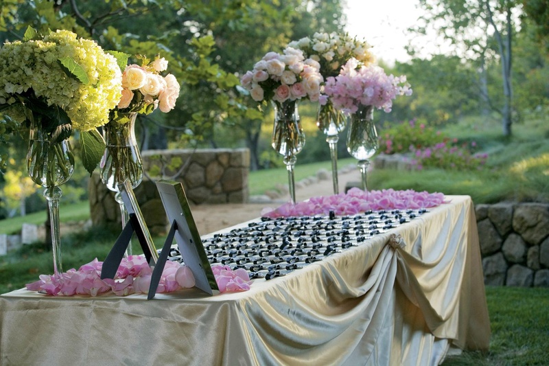 Outdoor Favors Table
Photography: Melissa Musgrove Photography
Read More:
http://www.insideweddings.com/weddings/isabelle-bridges-and-brandon-boesch/234/ Gold linens topped with silver luggage tags