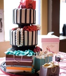 Black and White Paris-Themed Cake
Photography: dMdC Photography
Read More:
http://www.insideweddings.com/weddings/black-white-pink-fashion-themed-bridal-shower/490/ Black and white striped cake with fashion details