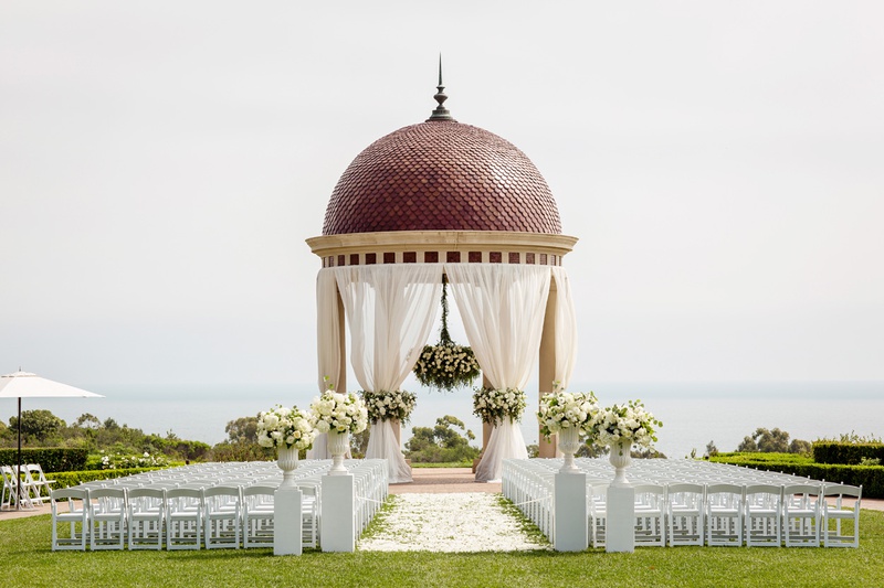 Ceremony with Rotunda
Photography: Chard Photo
Read More:
http://www.insideweddings.com/weddings/alfresco-ceremony-on-the-coast-classic-ballroom-reception/1290/ the resort at pelican hill wedding under a rotunda with floral chandelier, newport wedding