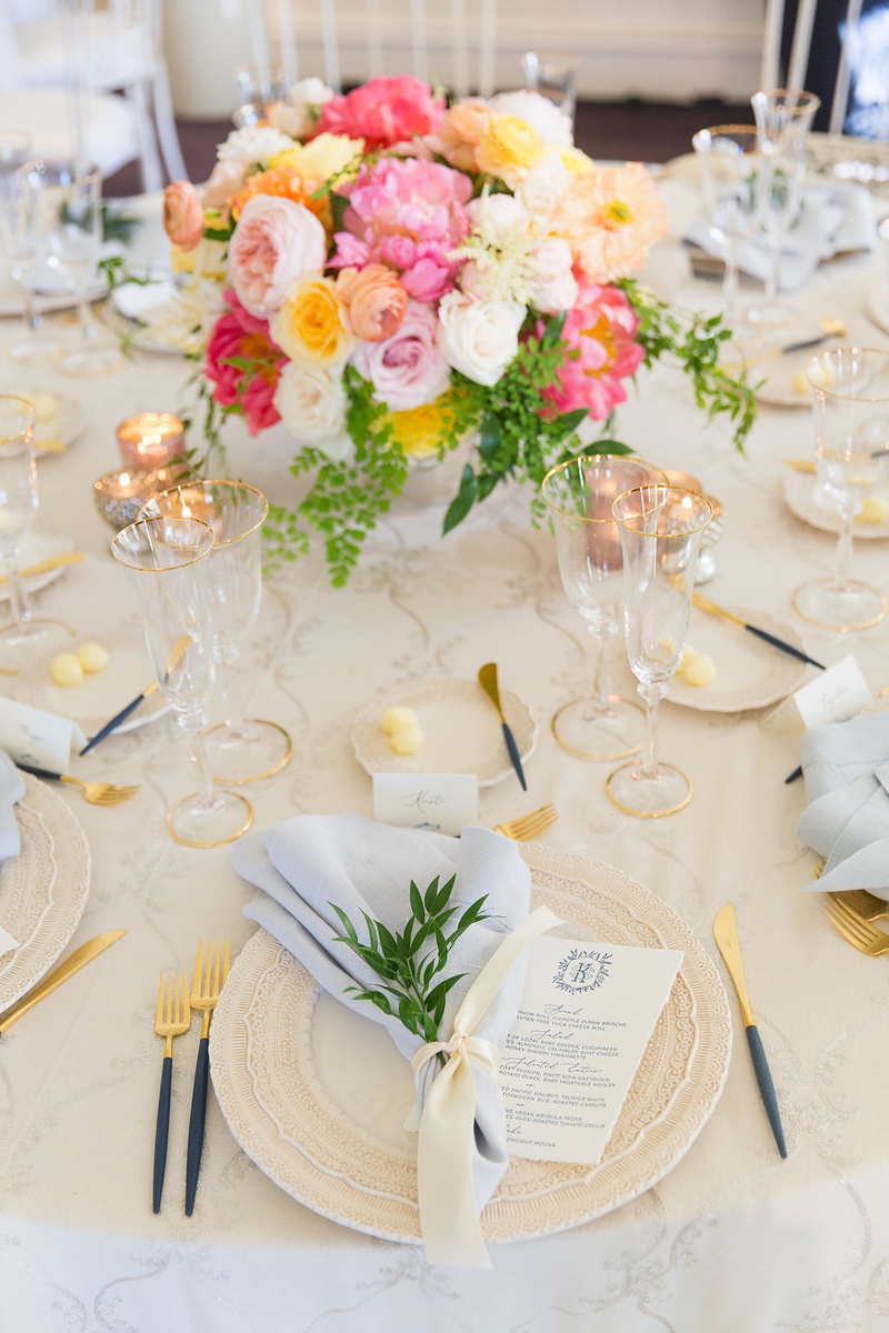 Blue, Pink, Yellow %26 Gold Tablescape
Photography: Ashley Paige Photography
Read More:
http://www.insideweddings.com/weddings/romantic-ocean-view-ceremony-charming-reception-in-california/1337/ wedding reception table beige linen blue napkin flatware pink yellow orange flower centerpiece