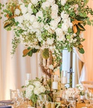 Floral "Tree" Centerpieces
Photography: Mikel Healey Photography
Read More:
http://www.insideweddings.com/weddings/romantic-secret-garden-inspired-wedding-in-southern-california/1341/ wedding reception centerpiece birch tree trunk growing into white roses with greenery