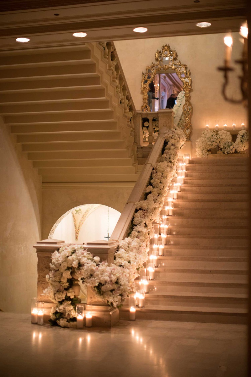 Staircase with Florals %26 Candles
Photography: The Day by Ira Lippke
Read More:
http://www.insideweddings.com/weddings/opulent-luxury-wedding-with-timeless-color-palette-in-new-york-city/1199/ wedding at the plaza hotel candles on staircase mirror white flower runner down railing