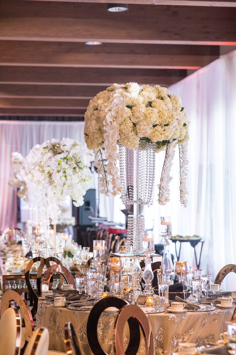 Ivory Orchid %26 Hydrangea Tall Centerpiece
Photography: Brian Bossany Photography
Read More:
http://www.insideweddings.com/weddings/luxurious-heaven-inspired-royal-wedding-celebration-in-minneapolis/1333/ wedding reception centerpiece tall flower arrangement crystal vase orchid ivory hydrangea flowers