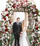 Newlyweds Underneath Colorful Floral Arch
Photography: Brandon Kidd Photography
Read More:
http://www.insideweddings.com/weddings/vibrant-alfresco-ceremony-ballroom-reception-in-newport-beach-ca/951/ newlyweds underneath colorful floral arch pelican hill resort wedding newport beach california berta
