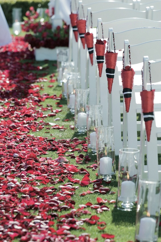 Flower Petal Aisle
Photography: Ventana Photography
Read More:
http://www.insideweddings.com/weddings/black-and-red-wedding-on-golf-course-at-the-lodge-at-torrey-pines/122/ Grassy aisle with red rose petals and petal cones on ceremony chairs