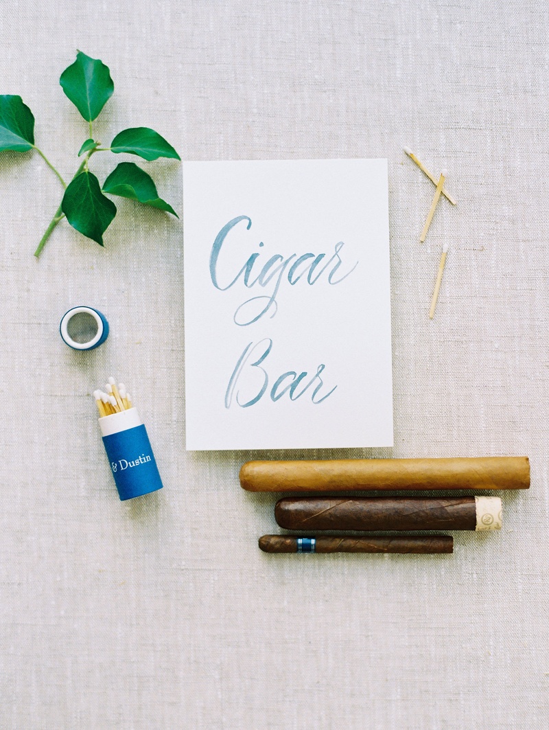 Cigar Bar Sign with Cigars
Photography: Bonnie Sen Photography
Read More:
http://www.insideweddings.com/weddings/outdoor-ceremony-tented-reception-by-a-tranquil-river-in-maryland/1088/ Wedding reception outdoor cigar bar at reception with matches personalized and cigar options