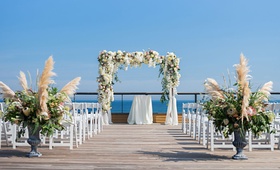 Ocean-View East Coast Ceremony
Photography: Kiss Me in Paris
Read More:
http://www.insideweddings.com/weddings/ocean-view-ceremony-romantic-reception-with-chic-coastal-elements/1190/ Montauk New York wedding ceremony desk pampas grass greenery white flowers white chairs