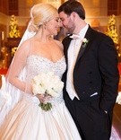 NYE Wedding Couple
Photography: Sarah Kate, Photographer
Read More:
http://www.insideweddings.com/weddings/traditional-catholic-ceremony-festive-new-years-eve-reception/1051/ Bride in strapless Pnina Tornai wedding dress from Kleinfeld bridal with white bouquet and groom