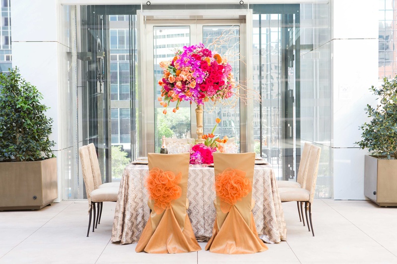 Vibrant Fall-Inspired Tablescape
Photography: Thisbe Grace Photography
Read More:
http://www.insideweddings.com/weddings/fall-inspired-wedding-styled-shoot-featuring-bold-metallic-details/868/ vibrant fall inspired tablescape orange pink purple champagne color chair covers pom poms