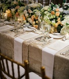 Long Napkins on Wedding Table
Photography: Chris Bailey Photography
Read More:
http://www.insideweddings.com/weddings/sophisticated-southern-soiree-in-texas-with-an-ode-to-new-orleans/1093/ Wedding reception tablescape low flower runner with beige damask linen gold candle votives napkins