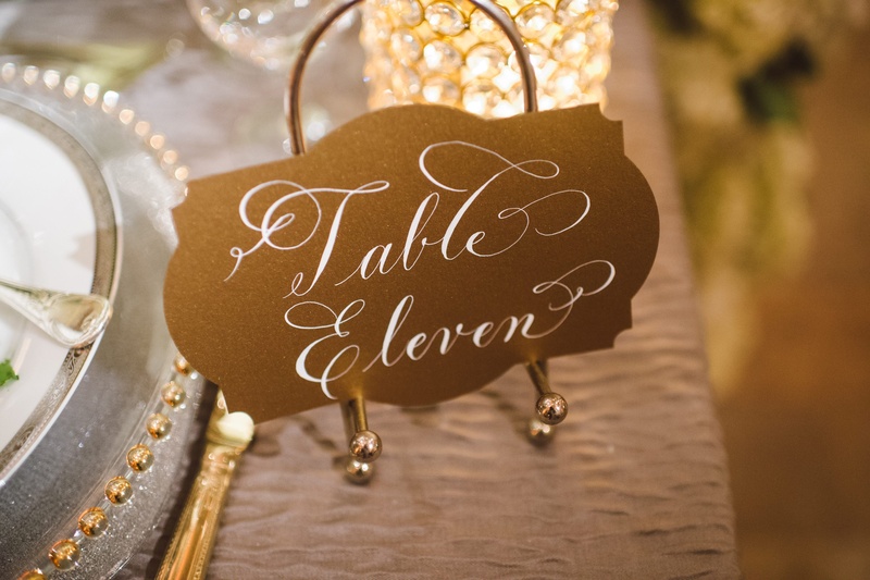 Gold Table Cards
Photography: J. Cogliandro Photography
Read More:
http://www.insideweddings.com/weddings/angela-mecca-and-owen-daniels/540/ Art Deco-inspired table numbers on gold easels