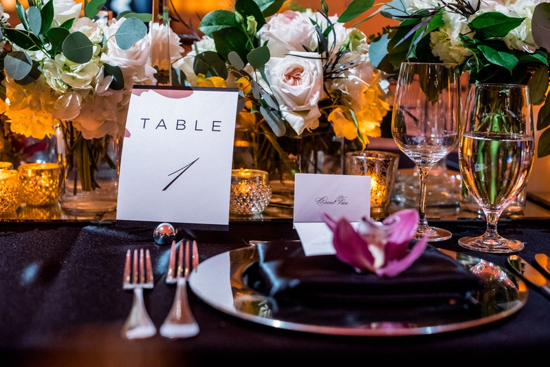 Black %26 White Table Number and Place Setting
Photography: Kim Fox Photography
Read More:
http://www.insideweddings.com/weddings/luxe-vintage-inspired-winter-wedding-in-downtown-los-angeles/1082/ Wedding reception black linens with pink and white flowers greenery burgundy flower minimalist