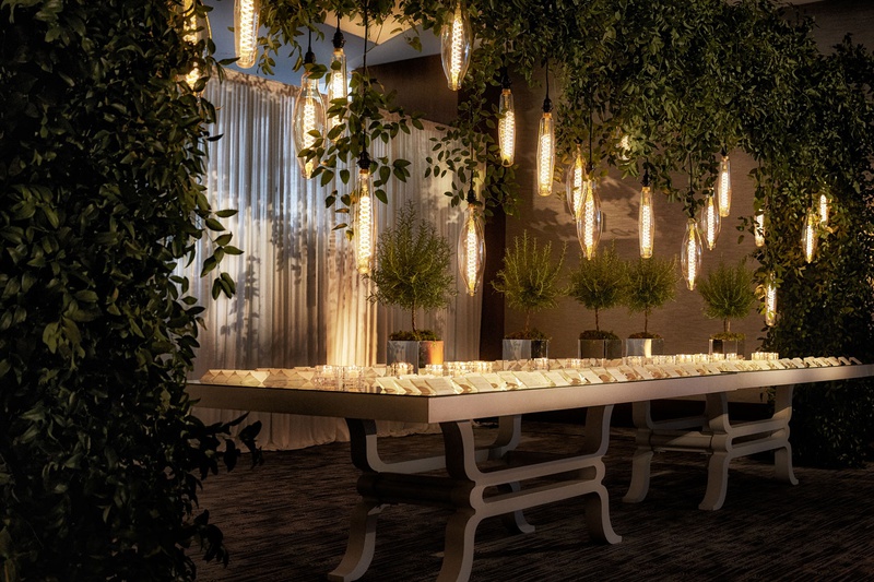 Escort Card Table with Unique Lights
Photography: KingenSmith
Read More:
http://www.insideweddings.com/weddings/modern-romantic-wedding-with-glam-geometric-details-in-chicago/1171/ wedding escort card table cocktail hour edison bulb lights trees greenery custom table design