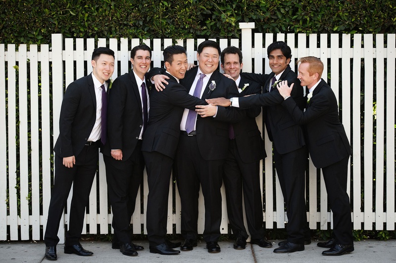 Groomsmen in Suits %26 Purple Ties
Photography: Next Exit Photography
Read More:
http://www.insideweddings.com/weddings/alfresco-interfaith-ceremony-ballroom-reception-in-santa-monica/963/ Groom and groomsmen smile and hug before wedding ceremony purple ties light purple dark purple
