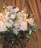 Floral Decor
Photography: Barnet Photography
Read More:
http://www.insideweddings.com/weddings/blush-ballroom-wedding-with-crystal-details-in-los-angeles/175/ Pink and white flowers in the center of a candelabra with pink candles
