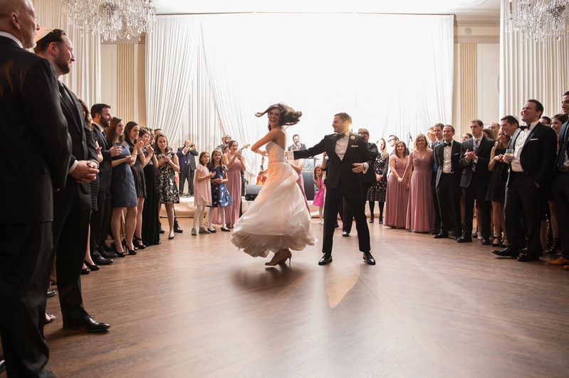 Groom Twirls Bride on Dance Floor
Photography: Carasco Photography
Read More:
http://www.insideweddings.com/weddings/jewish-wedding-with-classic-ivory-and-gold-decor-in-chicago/983/ bride in essence of australia wedding dress, groom in bonobos tux, twirl on dance floor