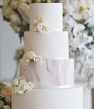 Marble Tier of Wedding Cake
Photography: Carasco Photography
Read More:
http://www.insideweddings.com/weddings/inspirational-wedding-shoot-with-light-fresh-color-palette/1167/ Minimalist wedding cake with blush and gold marble tier, fresh white flowers as accent