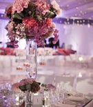 Colorful Table Centerpiece
Photography: Aaron Delesie Photographer
Read More:
http://www.insideweddings.com/weddings/all-white-beach-ceremony-sophisticated-ballroom-reception/364/ Mirrored tabletop with large pink floral arrangement