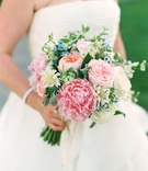 Summer Bouquet for Alfresco Ceremony
Photography: Bonnie Sen Photography
Read More:
http://www.insideweddings.com/weddings/outdoor-ceremony-tented-reception-by-a-tranquil-river-in-maryland/1088/ Bride in strapless wedding dress holding bouquet pink peony garden rose peach blue flower greenery