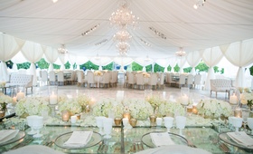 Head Table Overlooking Dance Floor
Photography: Samuel Lippke Studios
Read More:
http://www.insideweddings.com/weddings/alfresco-ceremony-with-ocean-view-glamorous-tented-reception/1081/ Wedding reception table glass tabletop crystals white glassware flowers gold candle votives