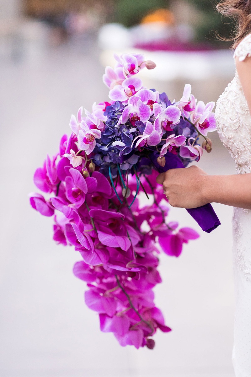 Cascading Purple Orchids
Photography: Brian Leahy Photography
Read More:
http://www.insideweddings.com/weddings/a-hawaiian-couples-luxurious-destination-wedding-in-las-vegas/1226/ cascading orchid bouquet in shades of purple, violet, fuchsia
