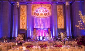 Purple %26 Gold Lighting at Reception
Photography: Premack Weddings
Read More:
http://www.insideweddings.com/weddings/dual-ceremony-with-indian-and-western-traditions/758/ Mellon Auditorium wedding reception with purple lighting