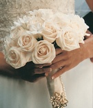 Classic Bridal Bouquet
Photography: Isabel Lawrence Photographers
Read More:
http://www.insideweddings.com/weddings/romantic-seaside-wedding-at-the-biltmore-in-santa-barbara/76/ Flowers wrapped in ribbon and pearls