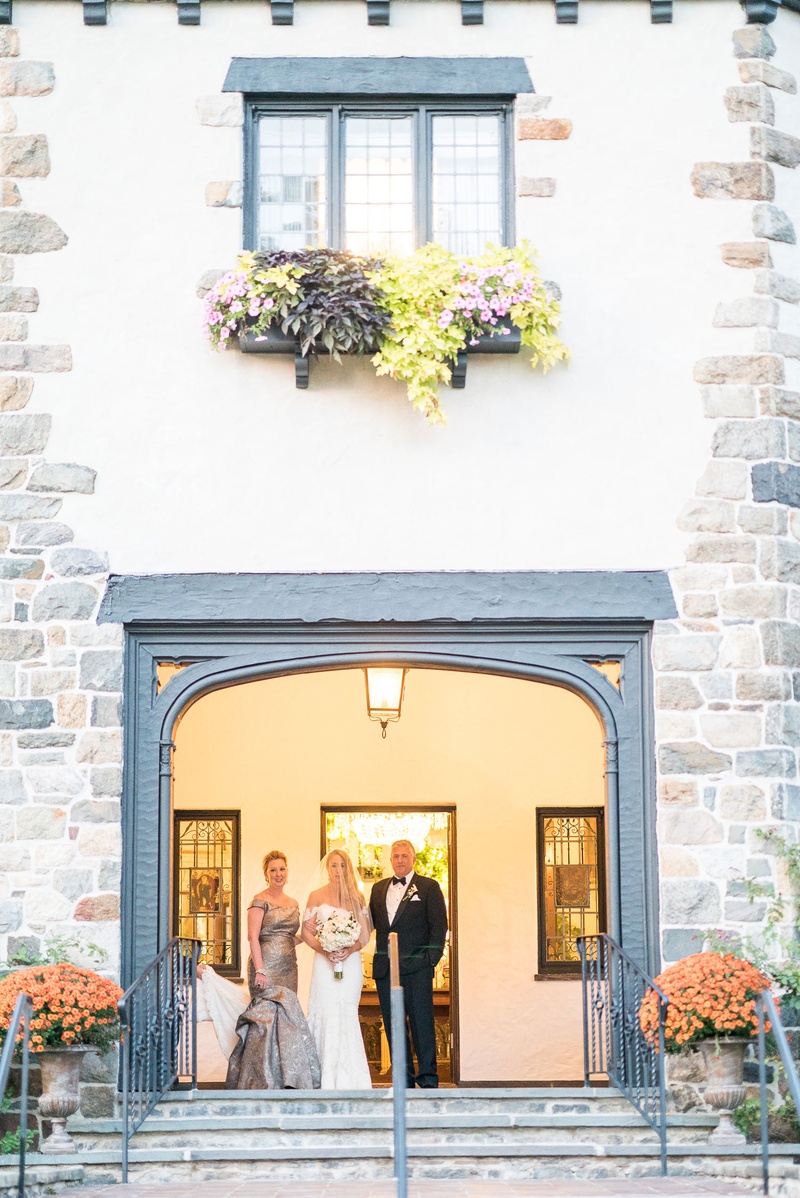 Parents of Bride at Château Venue
Photography: Robert Evans for 5th Avenue Digital
Read More:
http://www.insideweddings.com/weddings/outdoor-jewish-wedding-ceremony-at-stunning-chateau-in-new-jersey/1058/ Wedding ceremony bride entrance with mother and father parents doorway to chateau venue