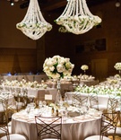 Large Blooms in Centerpiece
Photography: Deyla Huss Photography
Read More:
http://www.insideweddings.com/weddings/chic-wedding-with-sri-lankan-traditions-at-a-museum-in-portland/1332/ gold chameleon chairs at wedding reception with inverted glass vase with white roses and hydrangeas