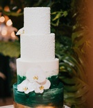 Emerald Green %26 Gold Wedding Cake
Photography: Jonathan Connolly Photography
Read More:
http://www.insideweddings.com/weddings/elegant-modern-wedding-with-emerald-color-palette-in-miami/1307/ wedding cake with four layers gold and green brush stroke paint design textured top layers orchid