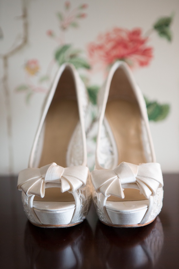 Lace Bridal Pumps
Photography: Aaron Watson Photography
Read More:
http://www.insideweddings.com/weddings/classic-virginia-wedding-inspired-by-grace-kellys-elegance/511/ Lace peep-toe wedding heels with ivory bows