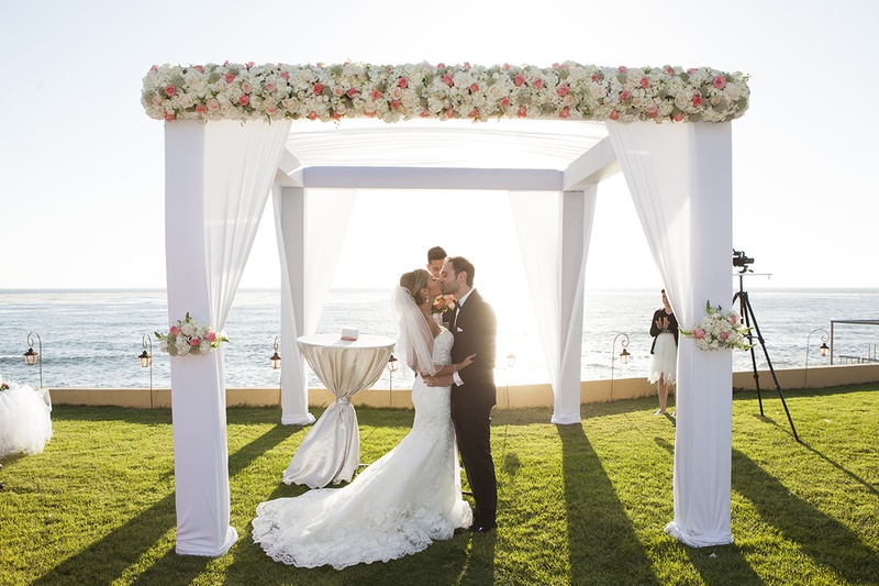 Bride %26 Groom Kiss at Destination Ceremony
Photography: Fusion Estudio
Read More:
http://www.insideweddings.com/weddings/destination-wedding-with-coral-ivory-grey-color-scheme-in-mexico/766/ Bride in wedding dress and groom in tuxedo kiss at oceanfront wedding ceremony in Mexico