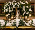 Sweetheart Table In Front of Cake Display