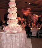 Tall Pink Floral Cake
Photography: John Derryberry Photography
Read More:
http://www.insideweddings.com/weddings/glamorous-pink-ballroom-wedding-in-austin-texas/214/ five tier white cake covered in realistic pink sugar flowers
