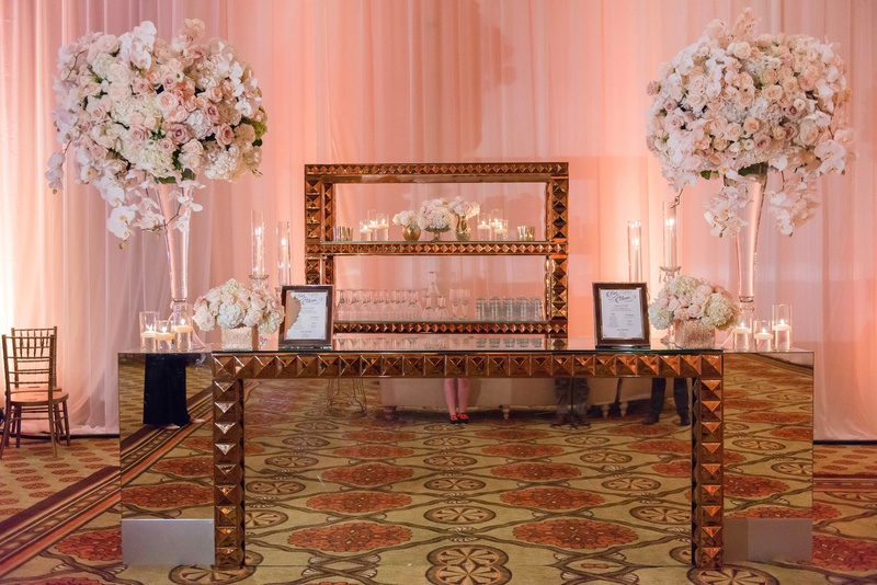 Mirror Bar with Pyramid Studs
Photography: The Yodsukars
Read More:
http://www.insideweddings.com/weddings/glam-10th-wedding-anniversary-party-vow-renewal-in-california/917/ Ballroom wedding reception mirror bar with pyramid studs gold two large flower arrangements roses