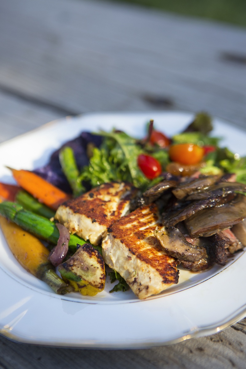 Miso-Glazed Halibut
Photography: Catherine Hall Studios
Read More:
http://www.insideweddings.com/weddings/rustic-classic-summer-wedding-in-lake-tahoe-california/645/ Salad and vegetables with grilled fish on plate