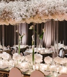 Baby's Breath %26 Calla Lily Décor
Photography: Heather Kincaid
Read More:
http://www.insideweddings.com/weddings/luxury-wedding-with-romantic-white-color-palette-in-beverly-hills/1128/ Baby's breath overhead flower arrangement on lucite column tall calla lily flowers white blooms
