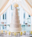 Silver Wedding Cake with White Florals
Photography: Crystal Stokes Photography
Read More:
http://www.insideweddings.com/weddings/white-blush-inspirational-wedding-shoot-at-urban-rooftop-garden/714/ Six layer wedding cake with white bottom and silver top tiers